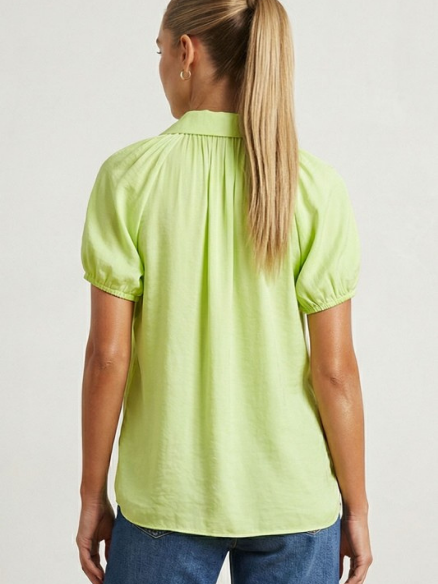 Mimi & Rae cutout button-down shirt featuring a stylish design with cutout details and a classic collar, shown on a model.