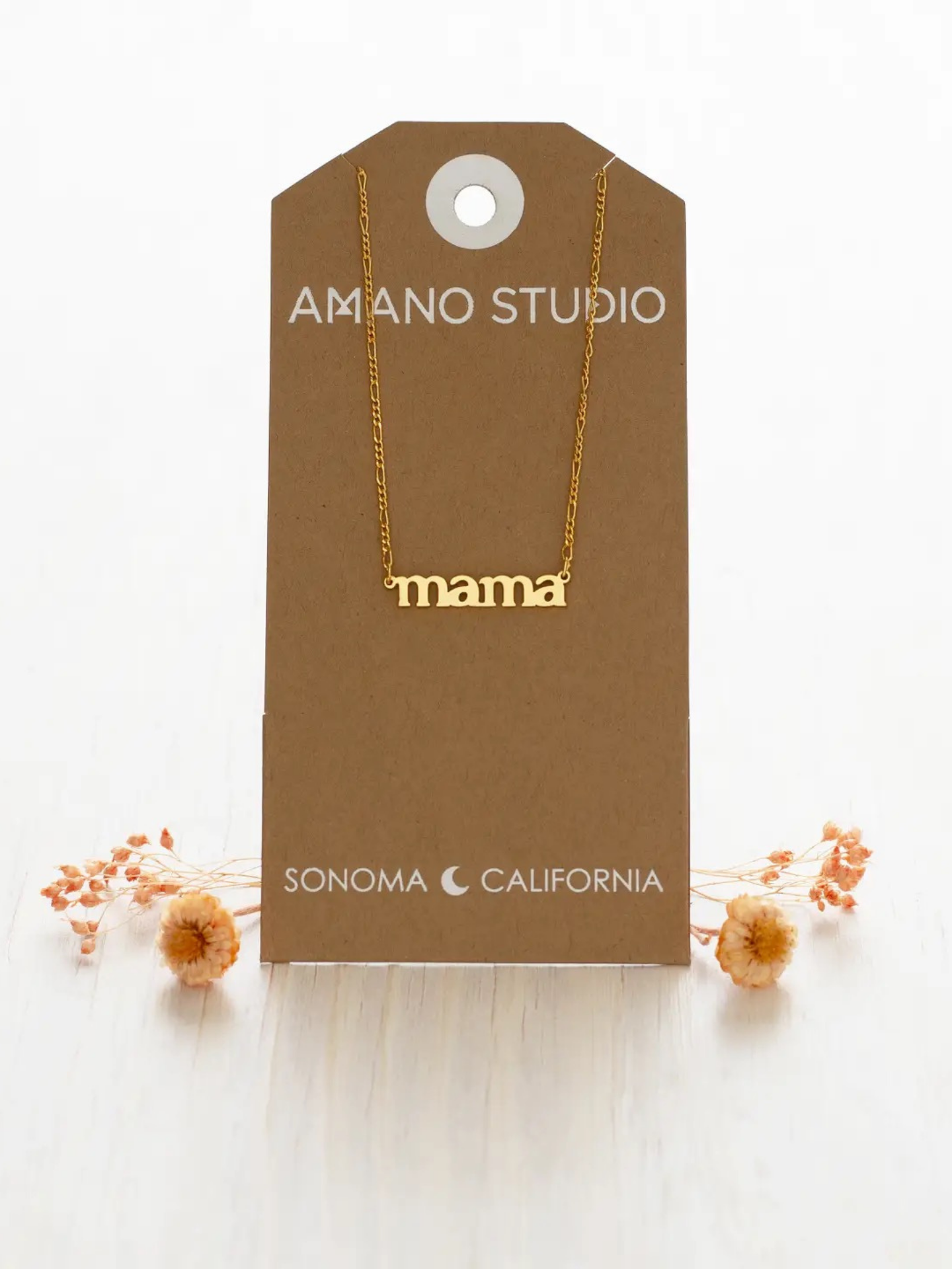 Amano Studios Mama Necklace with delicate gold chain and pendant, stylish jewelry accessory for mothers.