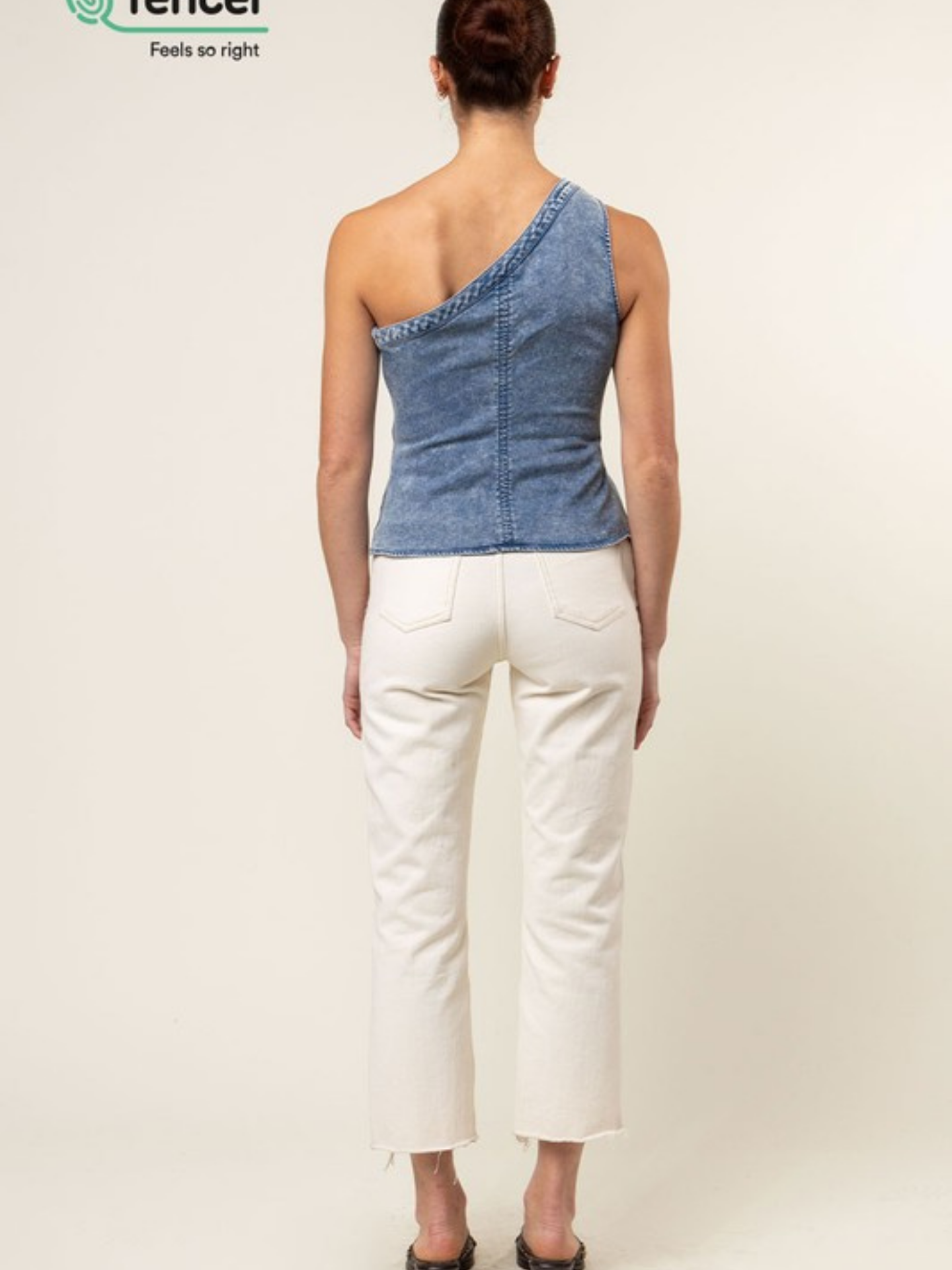 Blue Tencel one-shoulder braided blouse by Mimi & Rae, stylish women's apparel with a relaxed fit and elegant design.