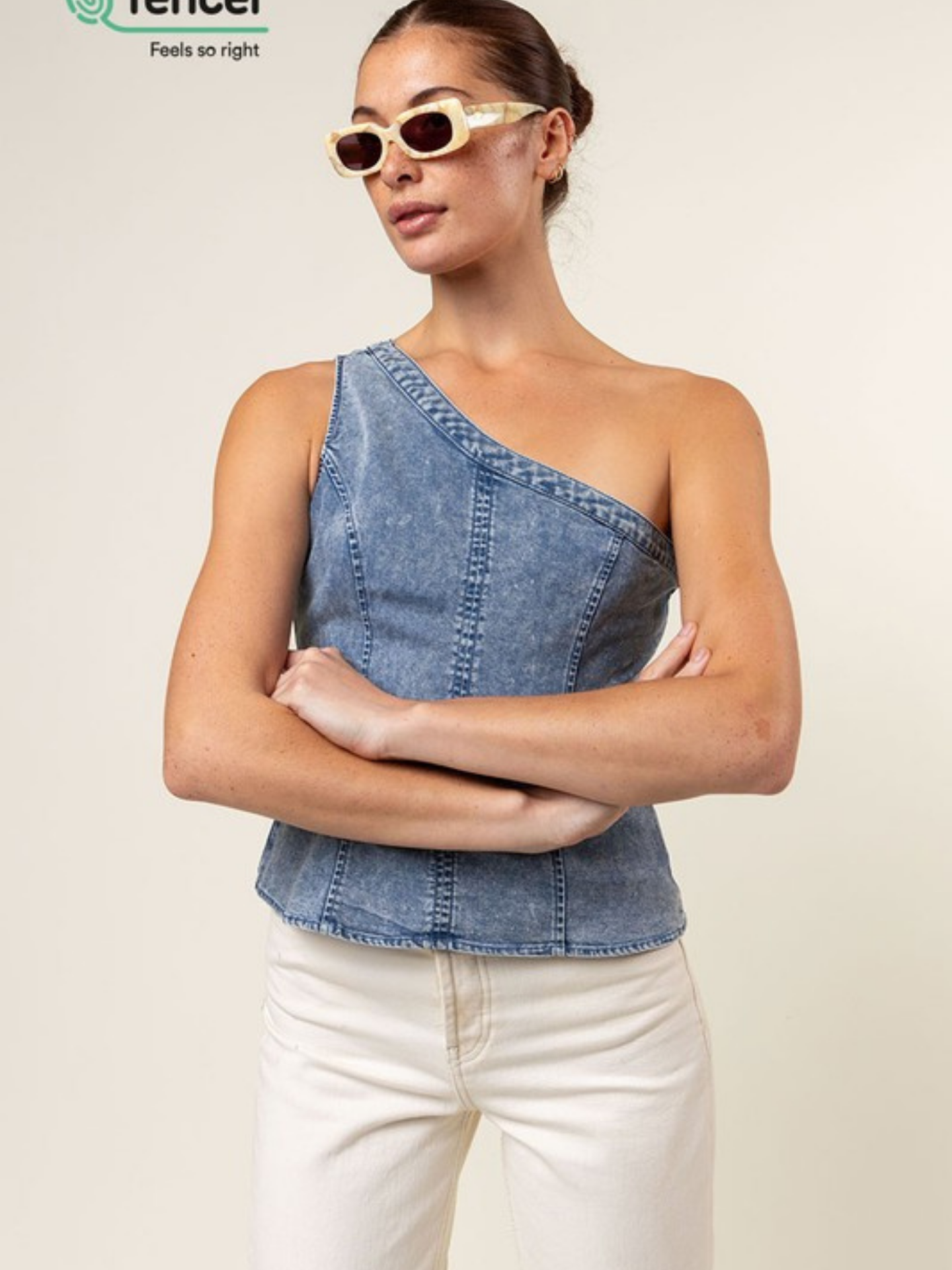 Blue Tencel one-shoulder braided blouse by Mimi & Rae, stylish casual top with unique shoulder design.