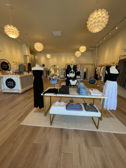 Mimi & Rae Store in Old Town La Quinta, CA featuring Meli Bianco bags, NLT tank and skirt, Studio Ko bamboo black strapless jumpsuit, Just Black Denim and Urban Daisy tops.