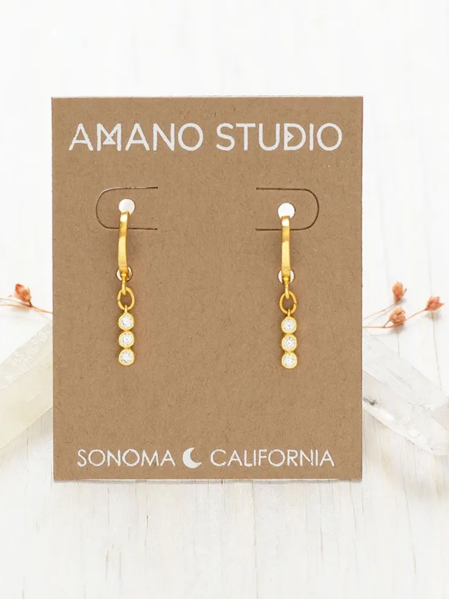 Amano Studios Iris Earrings featuring delicate floral design with silver and colorful enamel accents, hanging from silver hooks.