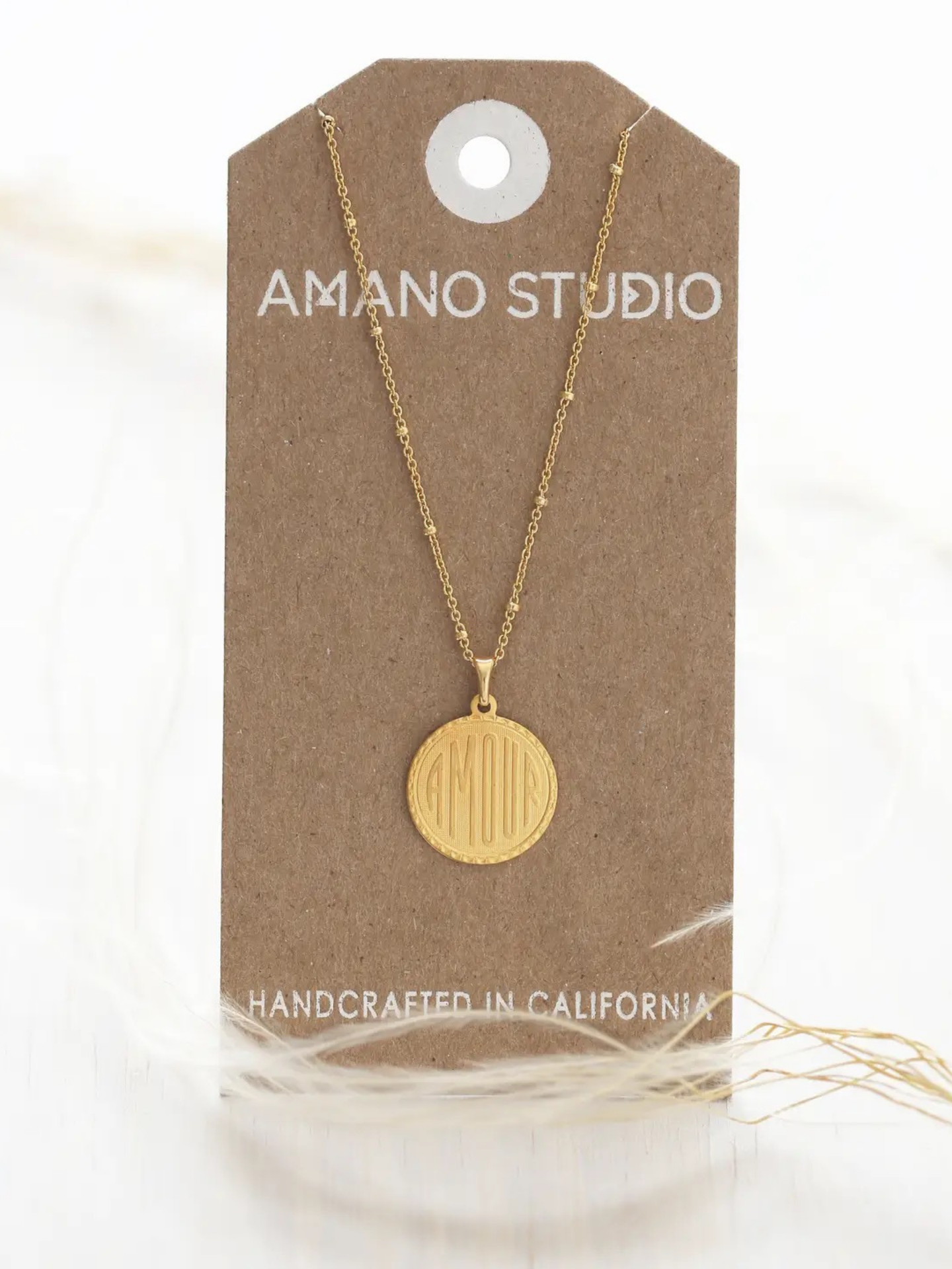 Amano Studios love necklace featuring a delicate heart pendant on a fine chain, ideal for romantic jewelry.