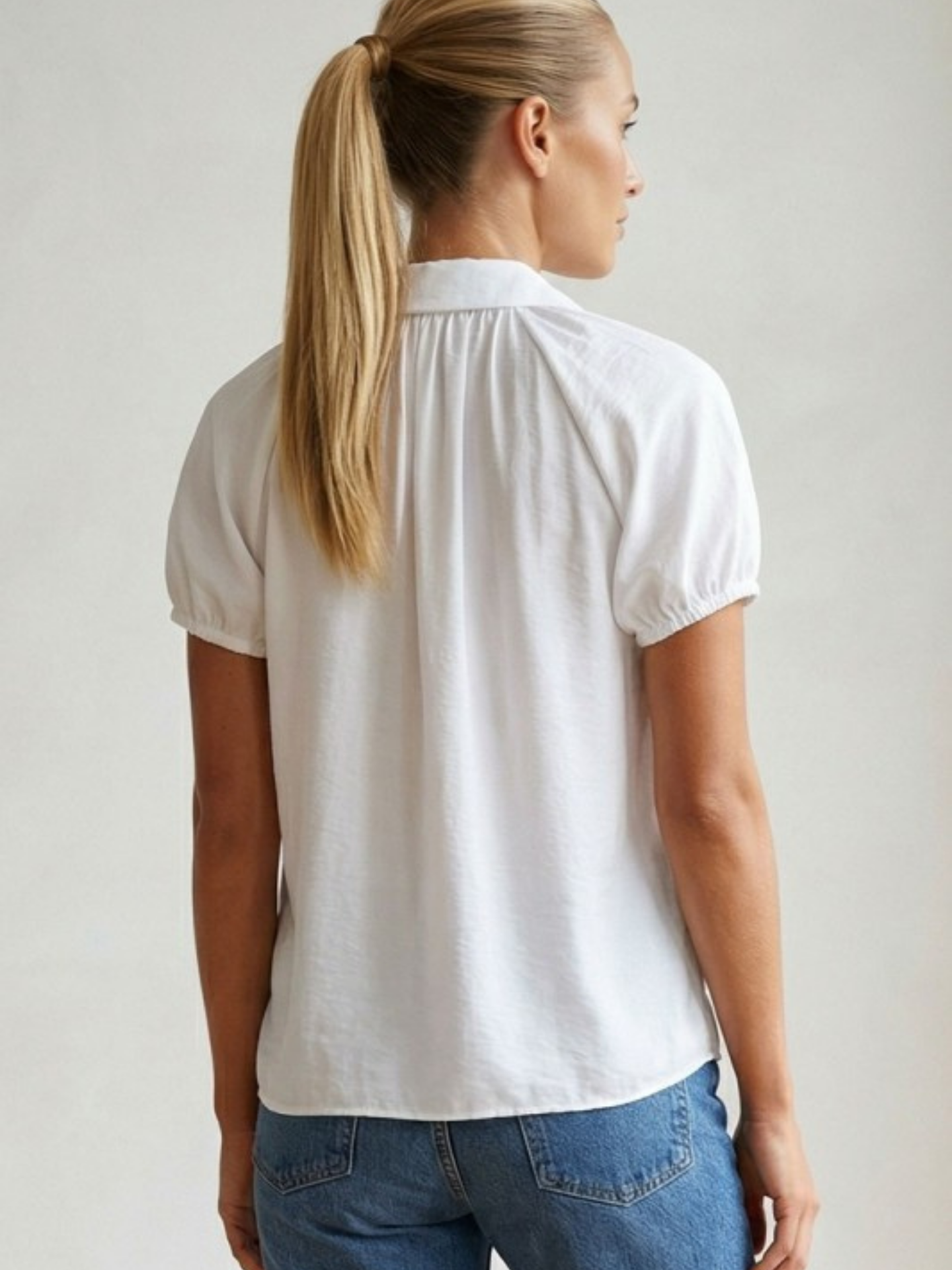 Mimi & Rae cutout button-down shirt with unique front cutouts and long sleeves, in a stylish casual design.