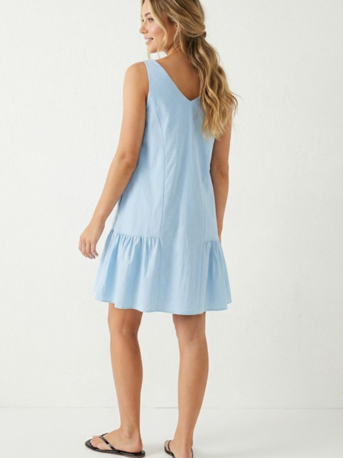 Naked Zebra ruffle mini dress with flowing fabric and feminine ruffle details, perfect for stylish summer or casual wear.