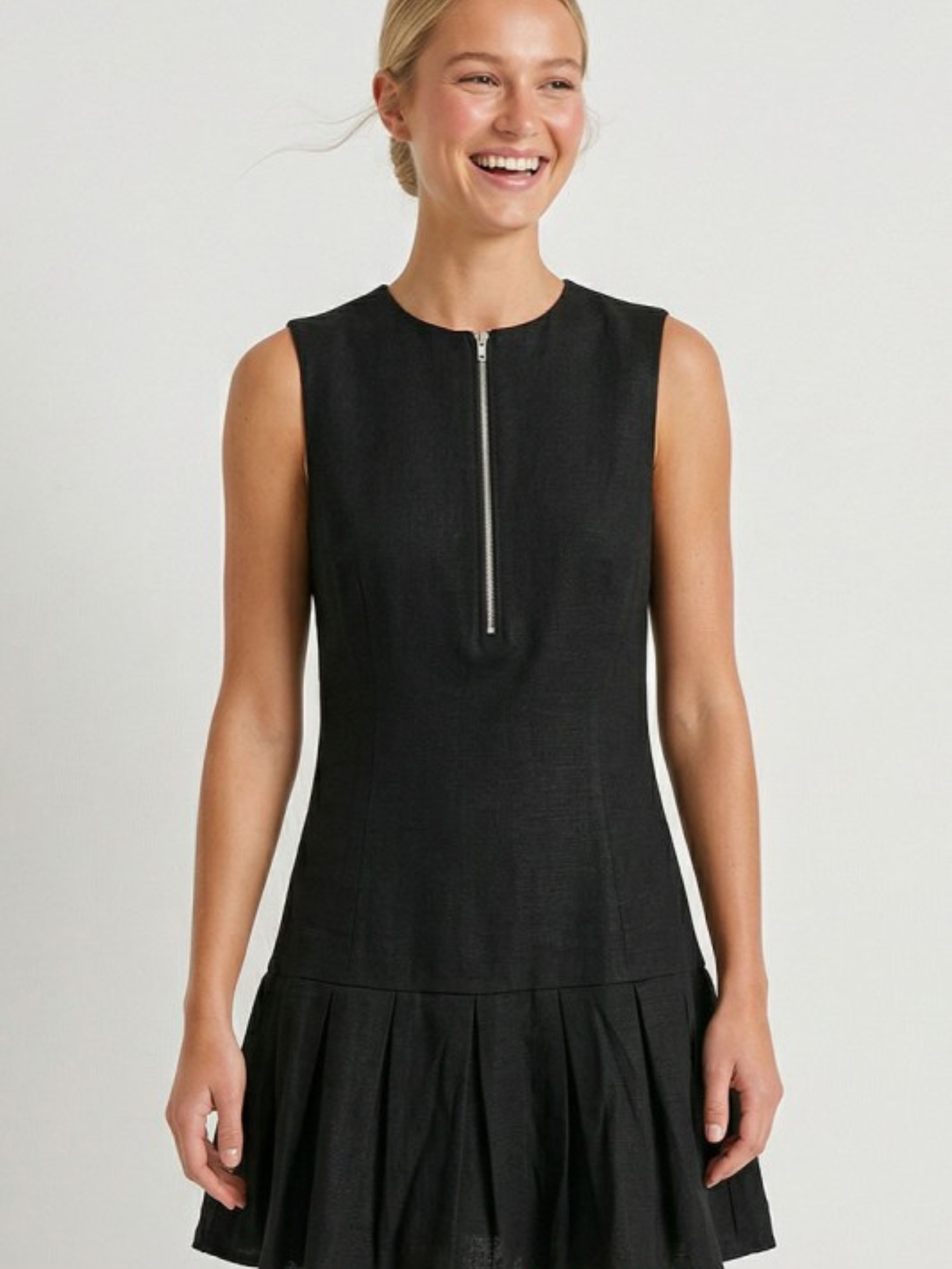 Mimi & Rae Loretta pleated hem mini dress in stylish apparel with a flattering fit and detailed pleated hem design.