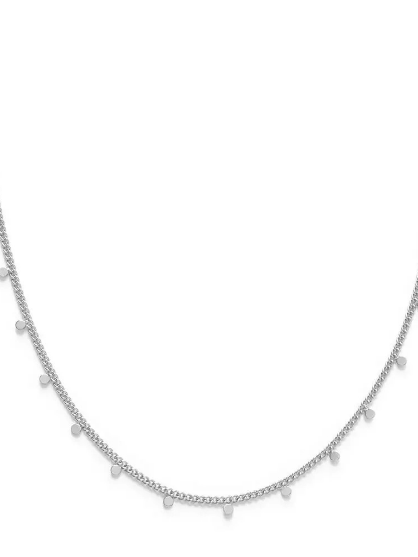 Amano Studios dot necklace featuring a string of small black and white ceramic or glass dots on a delicate chain.