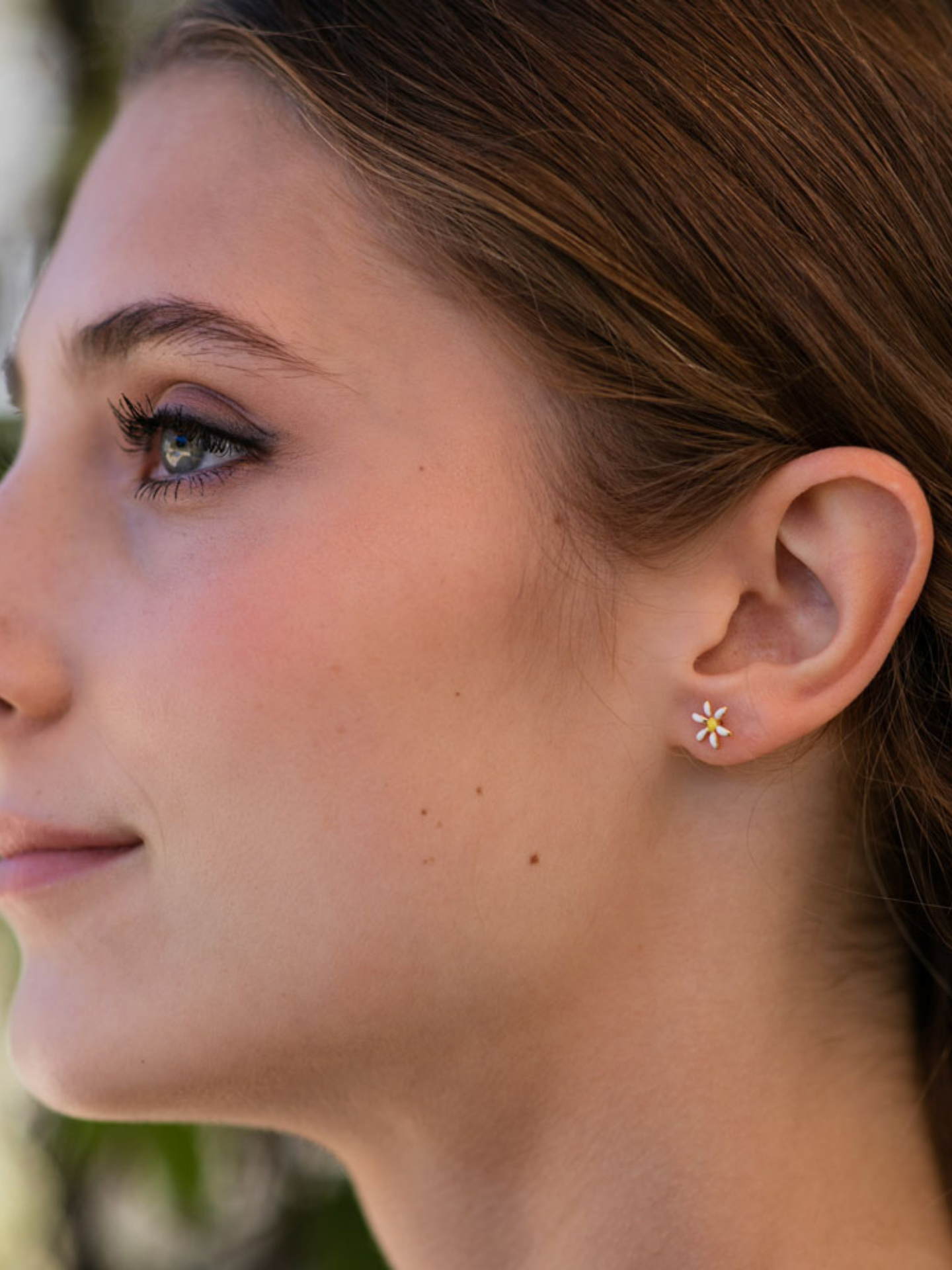 Amano Studios daisy earrings featuring delicate floral design on gold-tone hooks, perfect for accessories and jewelry.