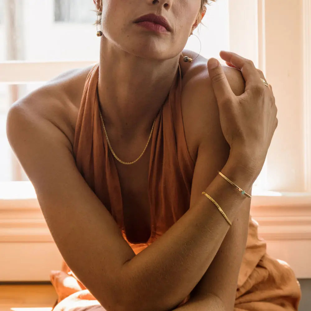 Amano Studios Willow Bracelet featuring a delicate, handcrafted design with woven details and natural-toned beads.