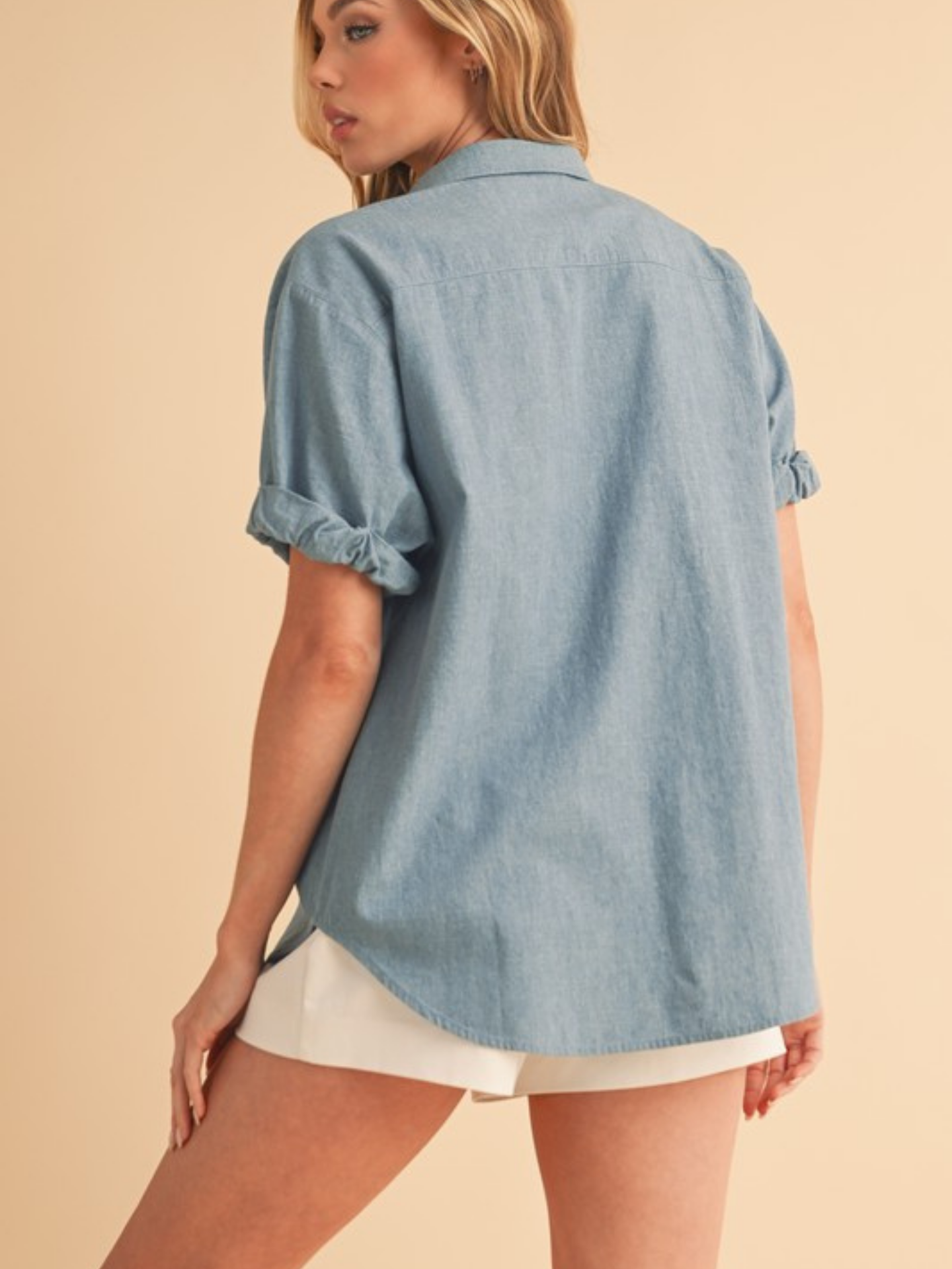 Aemi + Co blue denim button-up shirt with classic collar and button front, styled for casual wear.