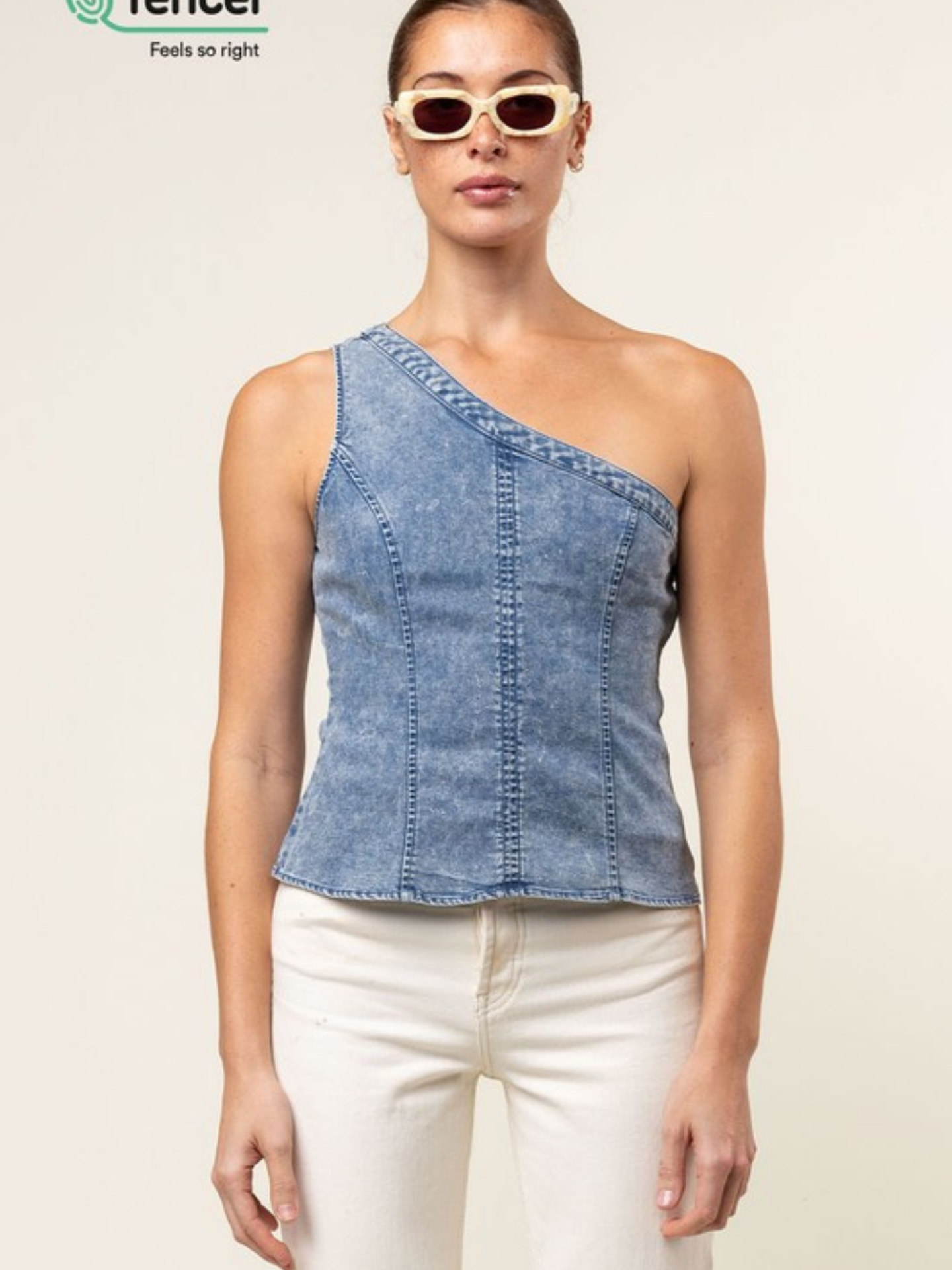 Blue Tencel one-shoulder braided blouse by Mimi & Rae, featuring a stylish design and lightweight fabric.