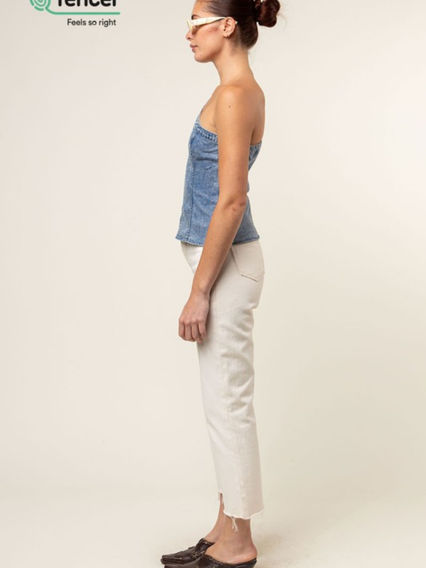 Blue Tencel one-shoulder braided blouse by Mimi & Rae, featuring a stylish off-shoulder design and lightweight fabric.